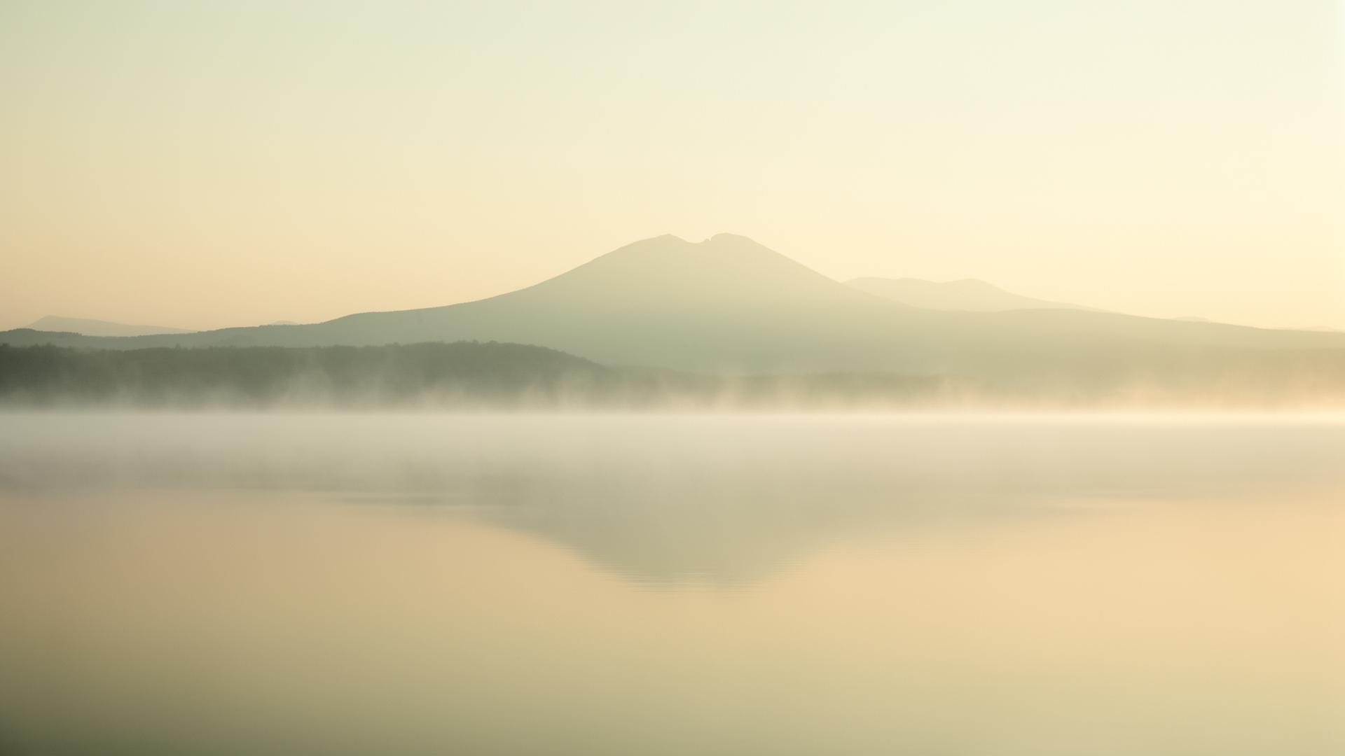 Soft mist over still water at dawn — a moment of quiet clarity